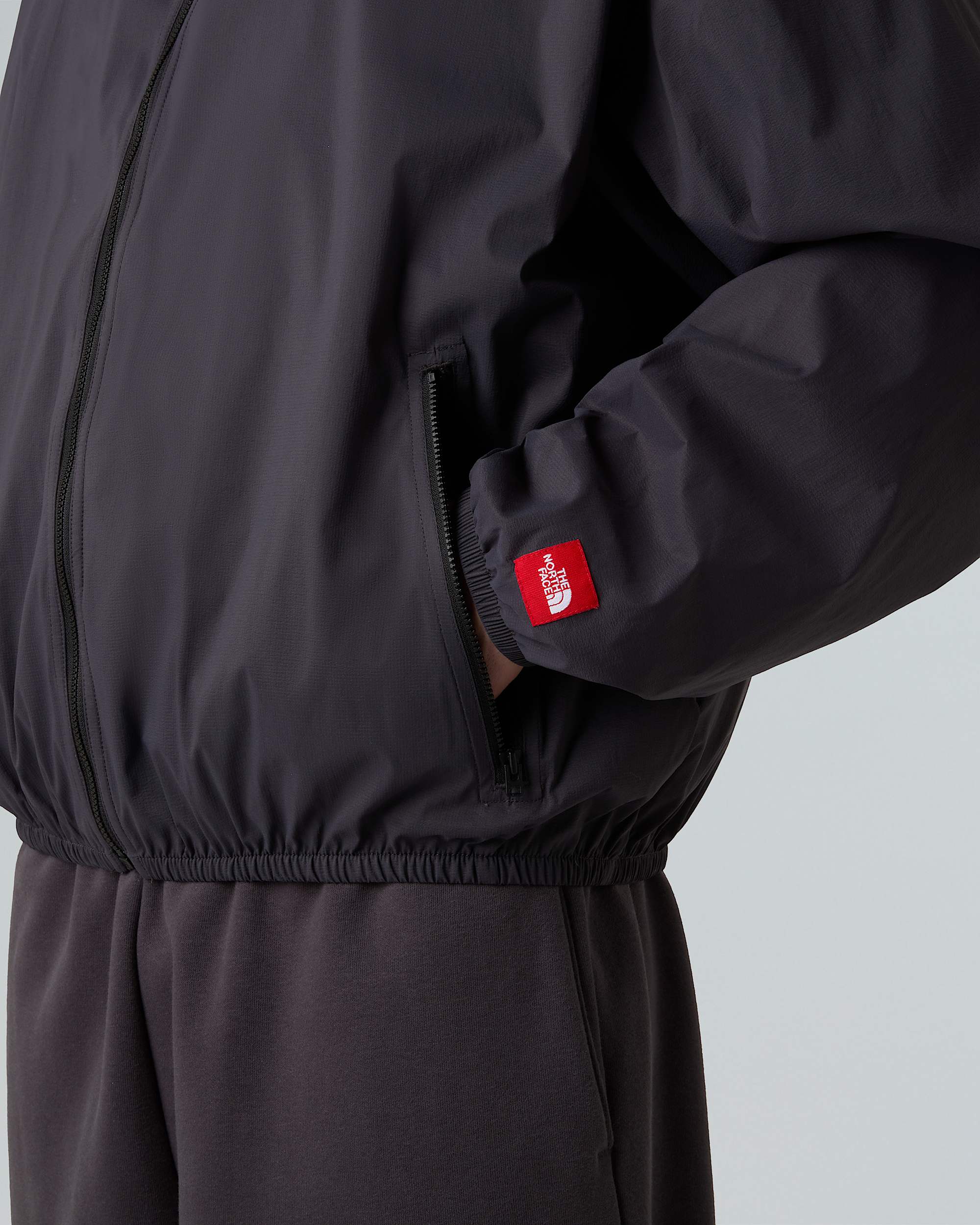 Unisex Red Box Packable Hooded Wind Jacket TNF ALT9