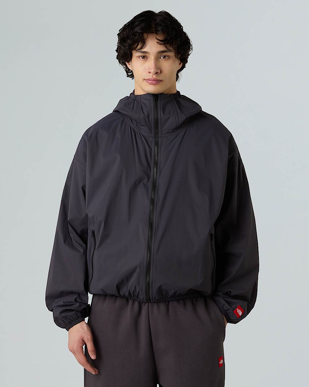 Unisex Red Box Packable Hooded Wind Jacket TNF ALT4