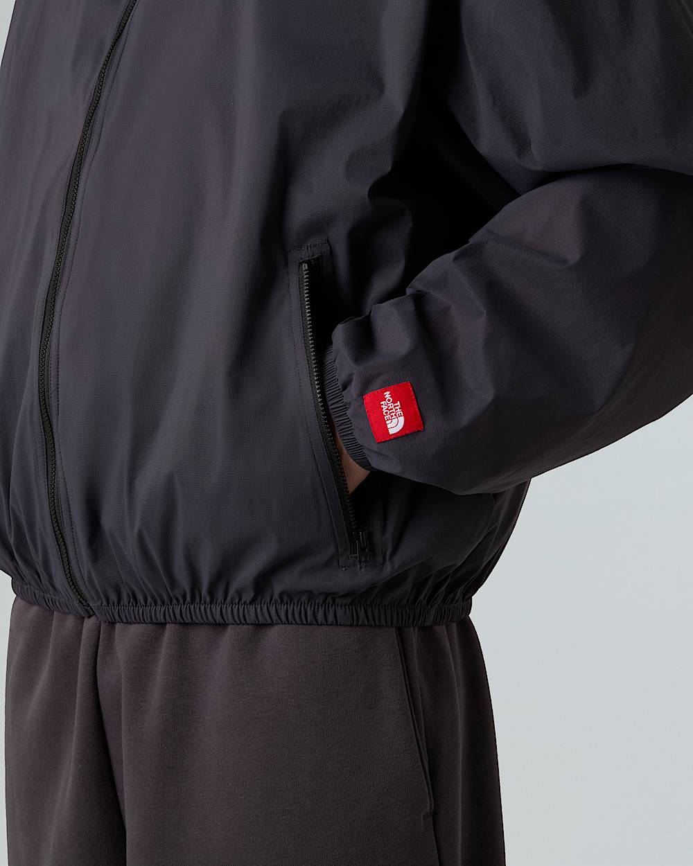 Unisex Red Box Packable Hooded Wind Jacket TNF ALT9