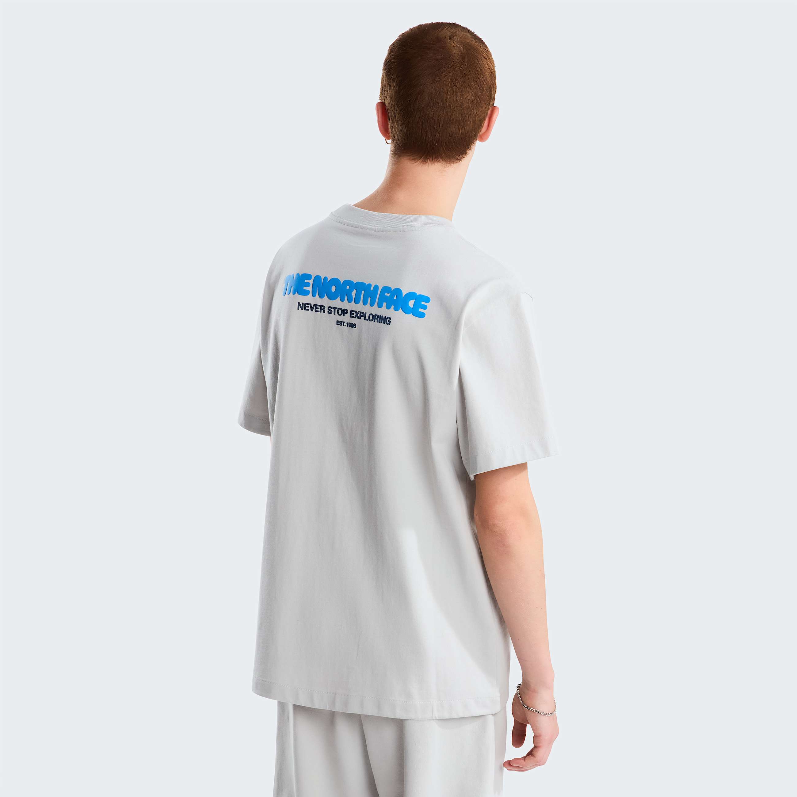 Camiseta grfica holgada con bolsillo Explore Fonts para hombre TNF HERO